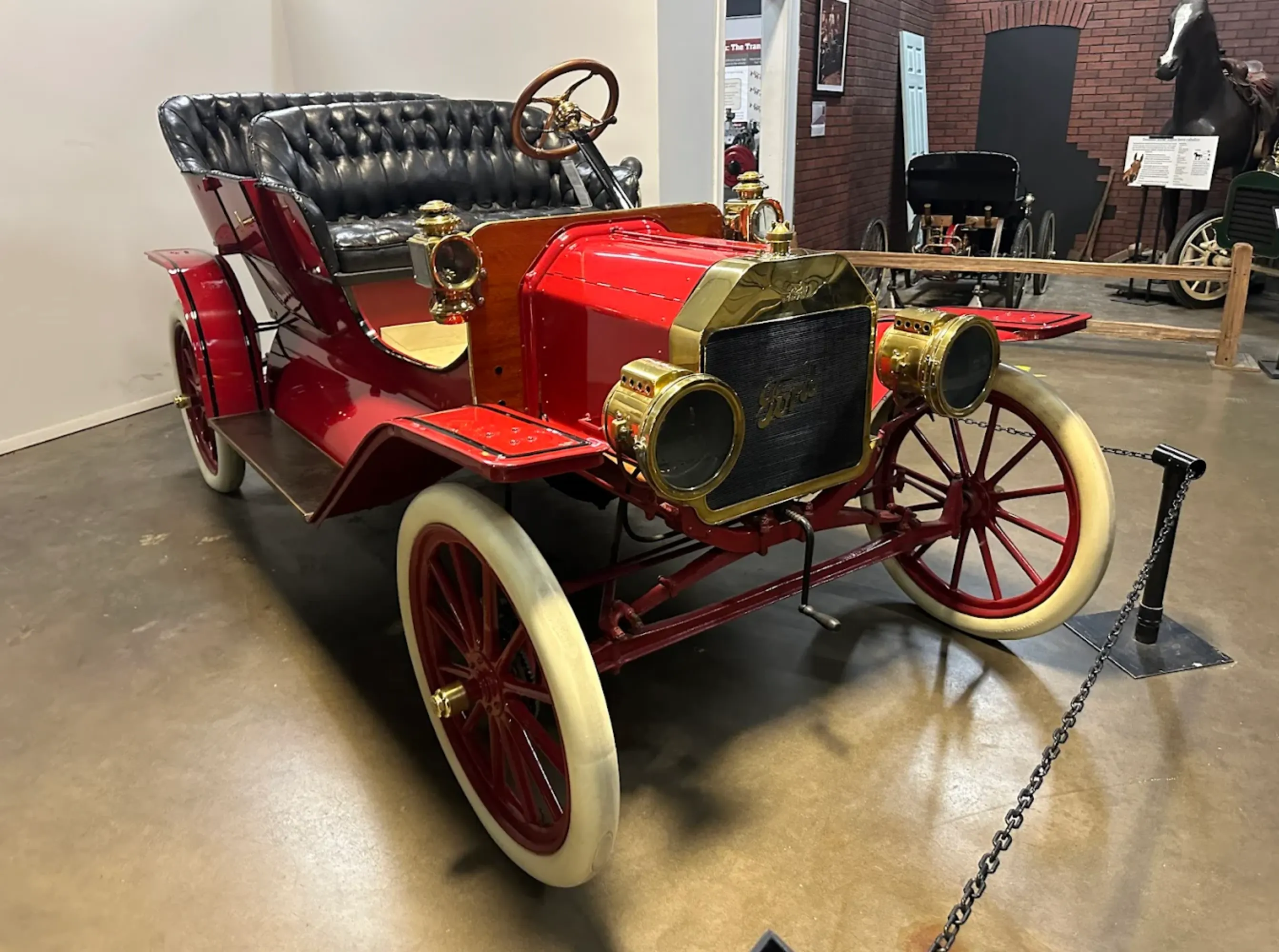 Classic cars line a gallery